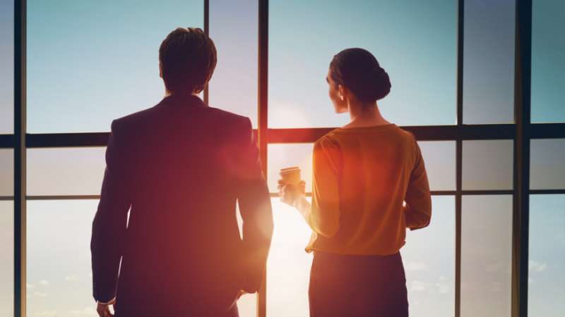 two people looking out the window